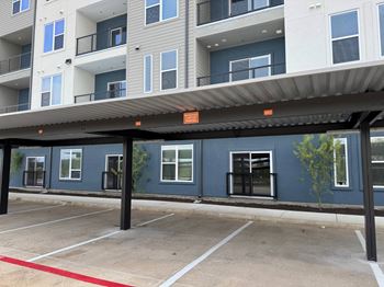 A parking lot with a red line painted on the ground.